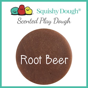 May include: A brown, round container of Squishy Dough scented play dough with the text "Root Beer" in white.