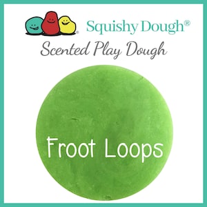 May include: A green ball of scented play dough with the text "Froot Loops" in white. The dough is from the Squishy Dough brand.