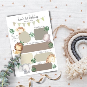 May include: A printable 1st birthday card with a jungle animal theme. The card has spaces for a photo and messages. The text on the card reads "Evie's 1st Birthday 3rd June 2022".