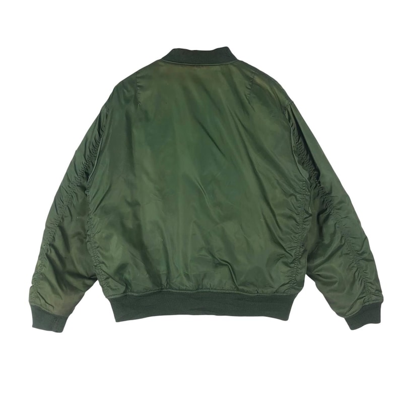 May include: A green bomber jacket with a ribbed collar, cuffs, and hem. The jacket has a smooth, shiny texture and a classic bomber silhouette. The back view shows the full shape of the jacket.