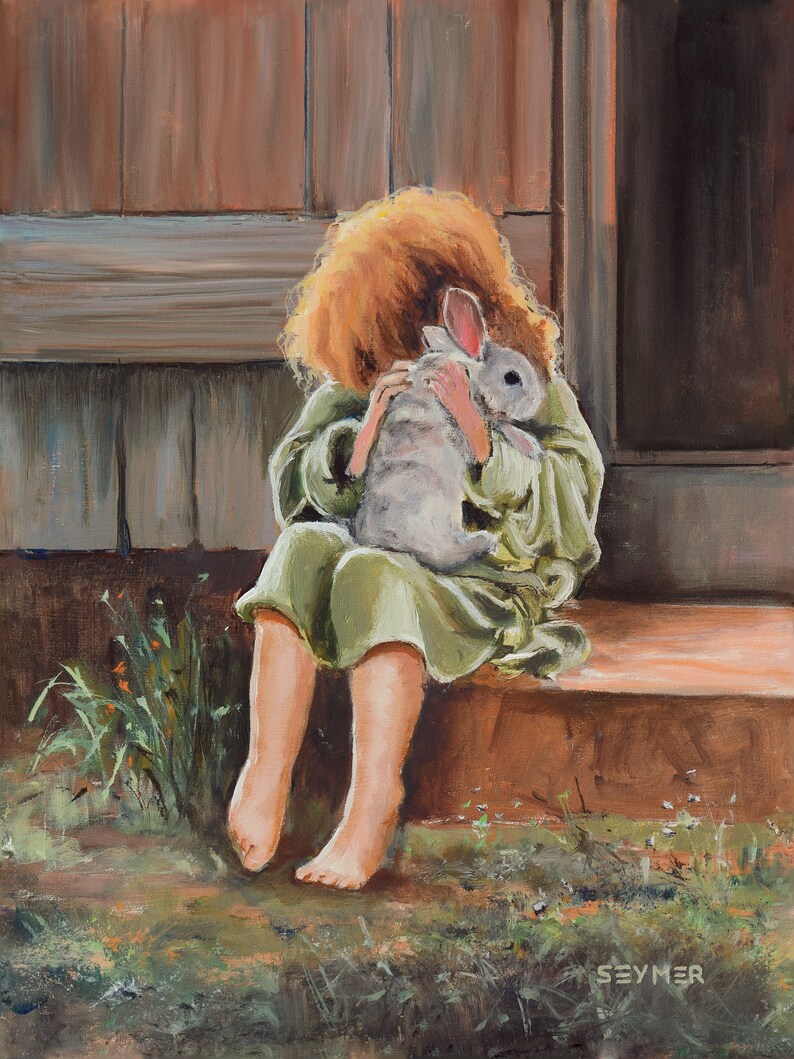 May include: A young girl with red hair sits on a wooden step, holding a white rabbit close to her chest. She is wearing a green dress and has a gentle expression on her face.