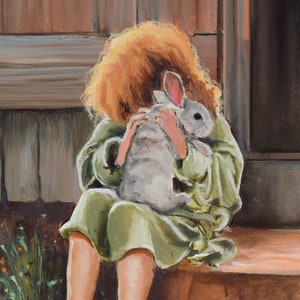 May include: A young person with long, red hair is holding a white rabbit close to their chest. The person is wearing a green robe and is sitting on a wooden step.