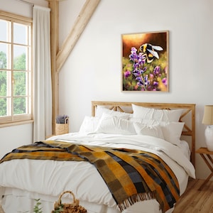 May include: A painting of a bumblebee pollinating a purple flower. The bee is in focus and the flower is blurred in the background. The painting is framed and hanging on a white wall in a bedroom.