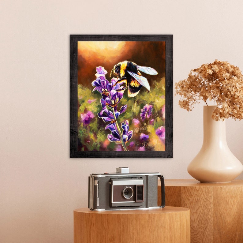 May include: A framed painting of a bumblebee pollinating a purple flower. The painting is set against a background of a field of flowers.
