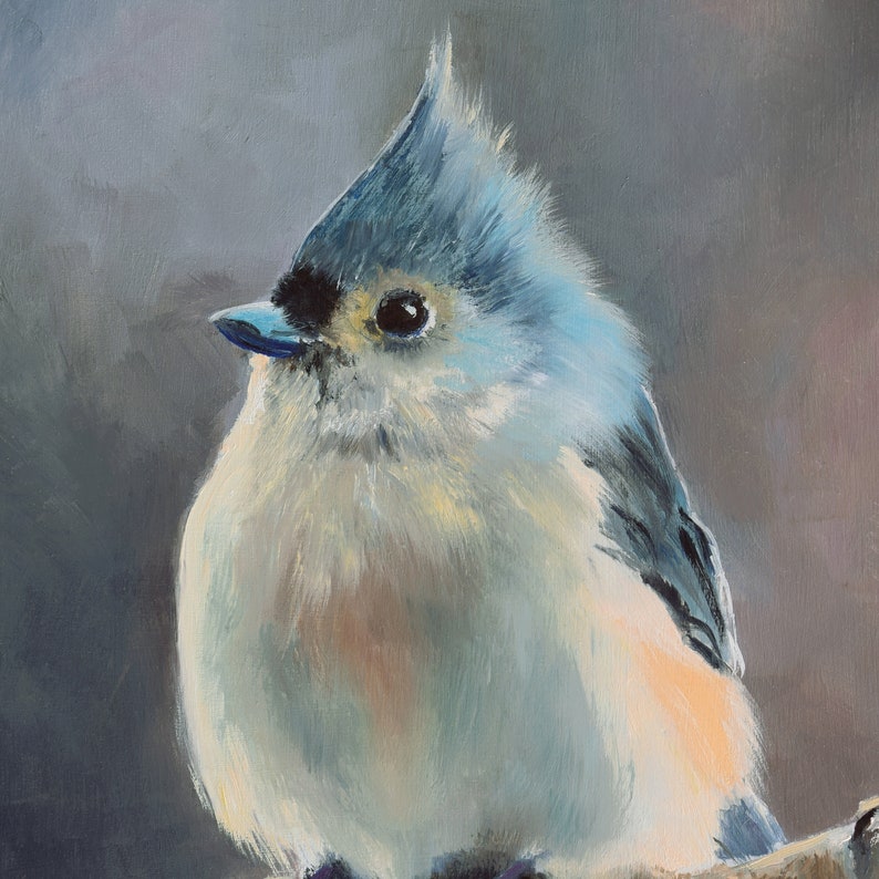 May include: A close-up painting of a small, fluffy blue bird with a white chest and a black eye. The bird is perched on a branch and looking to the left.