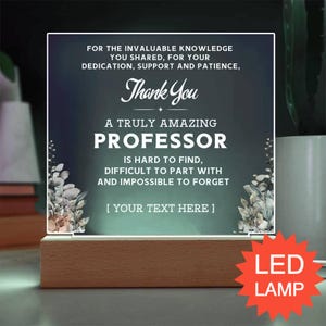 May include: A square acrylic LED lamp with a wooden base featuring white text that reads: FOR THE INVALUABLE KNOWLEDGE YOU SHARED, FOR YOUR DEDICATION, SUPPORT AND PATIENCE, THANK YOU. A TRULY AMAZING PROFESSOR IS HARD TO FIND, DIFFICULT TO PART WITH AND IMPOSSIBLE TO FORGET [ YOUR TEXT HERE ]. The design includes botanical illustrations on the sides against a dark green gradient background.