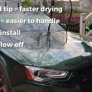 May include: A green car with a black grill and a black Audi logo. A person is using a leaf blower to dry the car after washing it. The leaf blower has a green and black handle and a black nozzle. The text on the image reads: "Tapered tip = faster drying", "Shorter = easier to handle", "Easy to install", "Won't blow off".