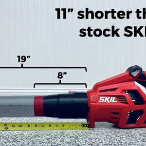 May include: A red and black cordless leaf blower with a 19-inch long tube and an 8-inch long handle. The leaf blower is labeled "SKIL" and is 11 inches shorter than the stock SKIL tube.