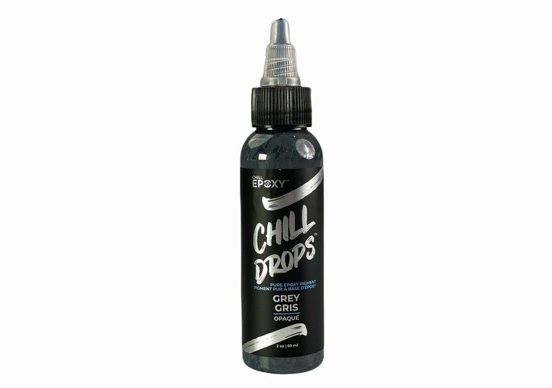 May include: A bottle of Chill Epoxy Chill Drops pigment in Grey Gris, an opaque color. The bottle has a silver label with the brand name and product name.