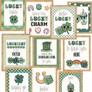 May include: Nine printable cards with a green, white, and brown color scheme. Each card features a different St. Patrick's Day themed illustration and text. The text includes phrases like "Lucky Vibes", "You're My Lucky Charm", "Feelin' Lucky", "Top O' The Morning To You", "Lucky To Have You Here", "Happy Go Lucky", and "Sham-Rock".
