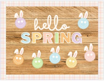 Könnte beinhalten: Ein Bulletin Board-Set mit einem Holzhintergrund und einem pastellfarbenen "Hallo Frühling"-Banner. Das Set enthält mehrere Hasengesichter mit Smiley-Gesichtern und Hasenohren.