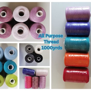 May include: Assortment of 10 spools of 1000 yard all purpose thread in various colours, including pink, purple, blue, green, grey, and orange.