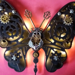 Steam Punk Style LED light up Butterfly Heart Wings, cogs and keys. Hand made .Gold and bronze effect design.Battery opperated not included.