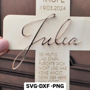 May include: A wooden cross with the name "Julia" engraved in cursive script. The cross also features the text "Zur Taufe 19.03.2024" and a verse about faith. The cross is a digital file for SVG, DXF, and PNG formats.