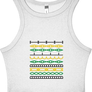 May include: A white tank top with a geometric design in black, yellow, and green. The design consists of horizontal rows of various shapes, including diamonds, rectangles, and wavy lines. The top is sleeveless with a scoop neck.