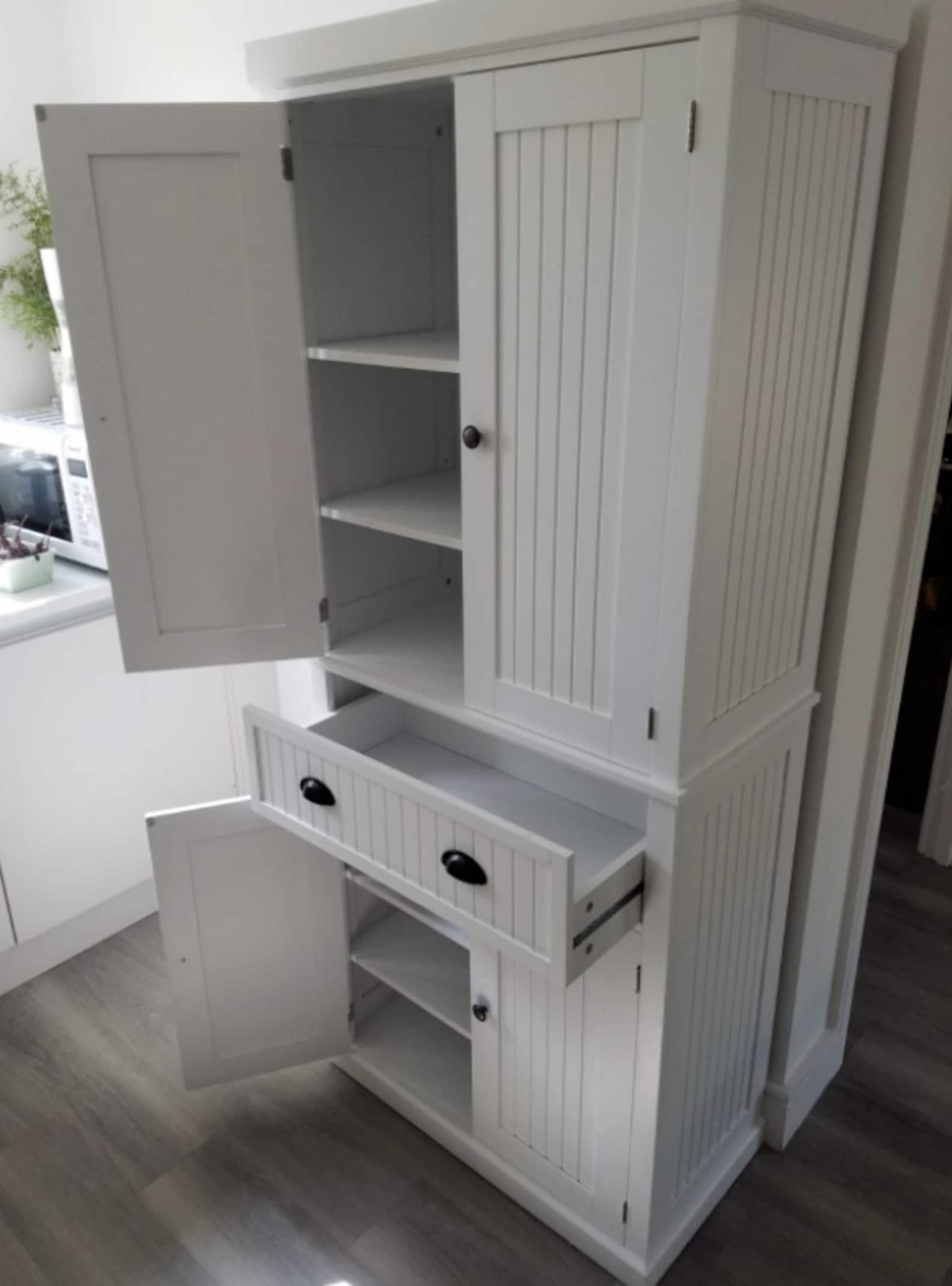 Elegant Tall White Kitchen Cupboard for Modern Home Kitchens