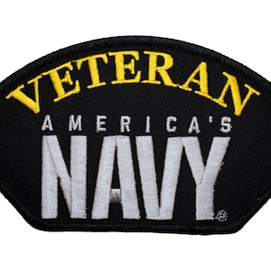 May include: Black embroidered patch with yellow text that reads "Veteran America's Navy".
