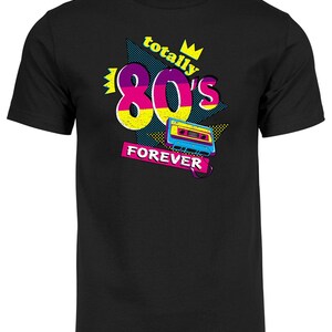 May include: Black t-shirt with a graphic design featuring a yellow 80's with a pink and purple outline, a crown, and the text "totally" and "forever". A blue and pink cassette tape is included in the design.