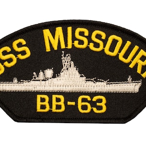 May include: A black embroidered patch with yellow lettering. The patch features a white silhouette of the USS Missouri battleship with the text "USS MISSOURI BB-63".