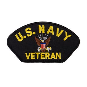 May include: Black embroidered patch with yellow text that reads "U.S. NAVY VETERAN". A gold eagle with a red, white, and blue shield is in the center of the patch.