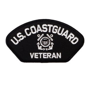 May include: A black embroidered patch with white lettering that reads "U.S. COAST GUARD VETERAN". The patch features the official Coast Guard emblem with a shield, anchor, and crossed axes.