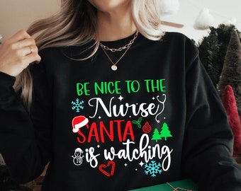 Christmas Nurse Shirts - Be Nice To The Nurse if Santa Is Watching Cursive Nurse - Christmas Shirt - Trendy christmas nurse shirt, Best sell