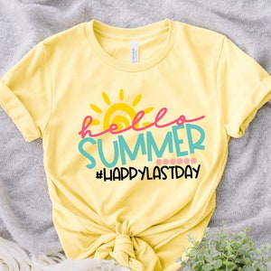 May include: Yellow t-shirt with a sun graphic and the text "hello summer #happylastday" in colourful lettering.