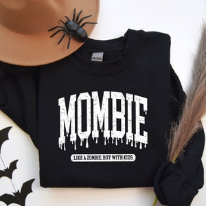 May include: Black sweatshirt with white text that reads "Mombie - Like a zombie, but with kids".