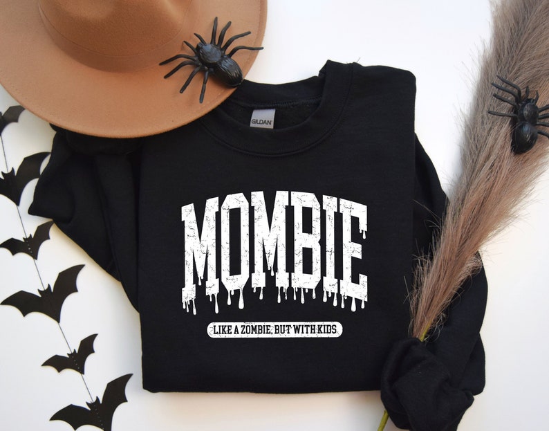 May include: Black sweatshirt with white text that reads "Mombie - Like a zombie, but with kids".