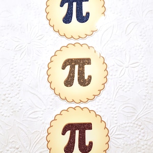 May include: Three round stickers with a white background and a brown border. Each sticker features a large, glittery pi symbol in a different color: blue, gold, and brown.