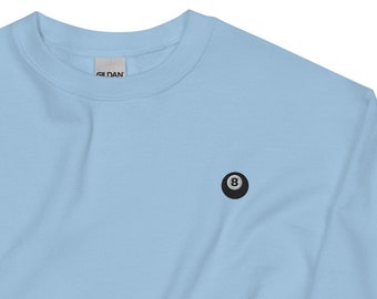 May include: A light blue sweatshirt with a black and white 8-ball embroidered on the front.