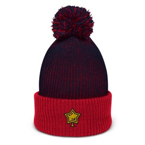 Gorro con pompón bordado de estrella navideña