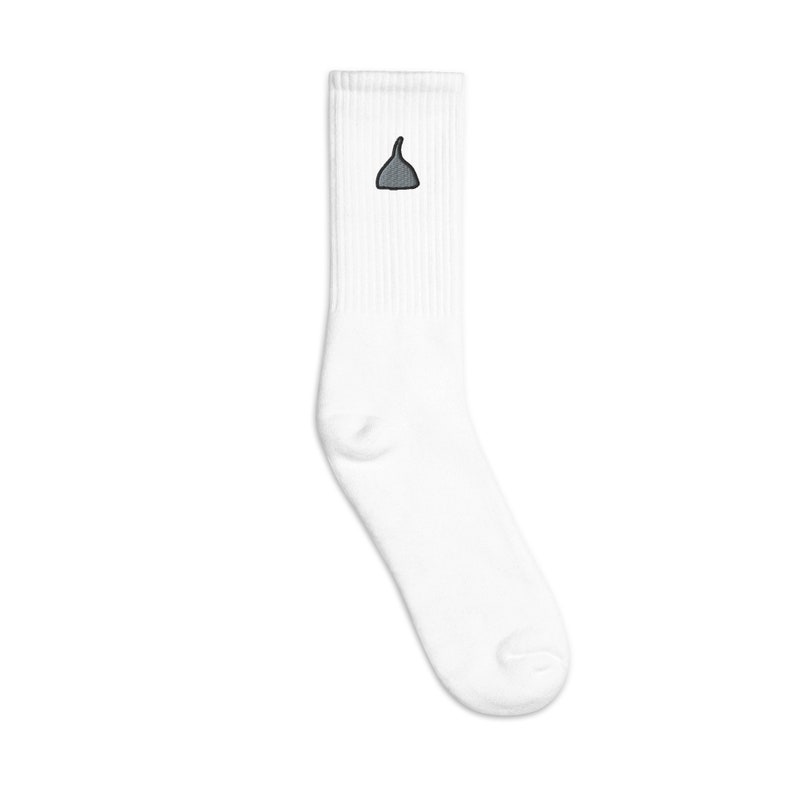 May include: White crew socks with a small gray embroidered design of a bell on the front.