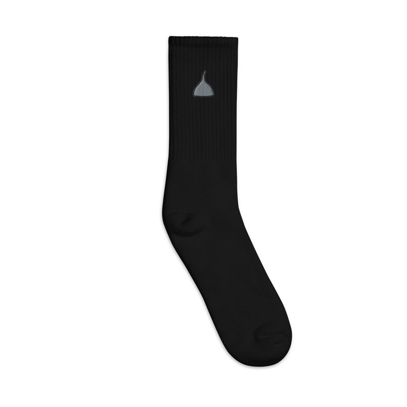 May include: Black crew socks with a small gray embroidered design on the front.