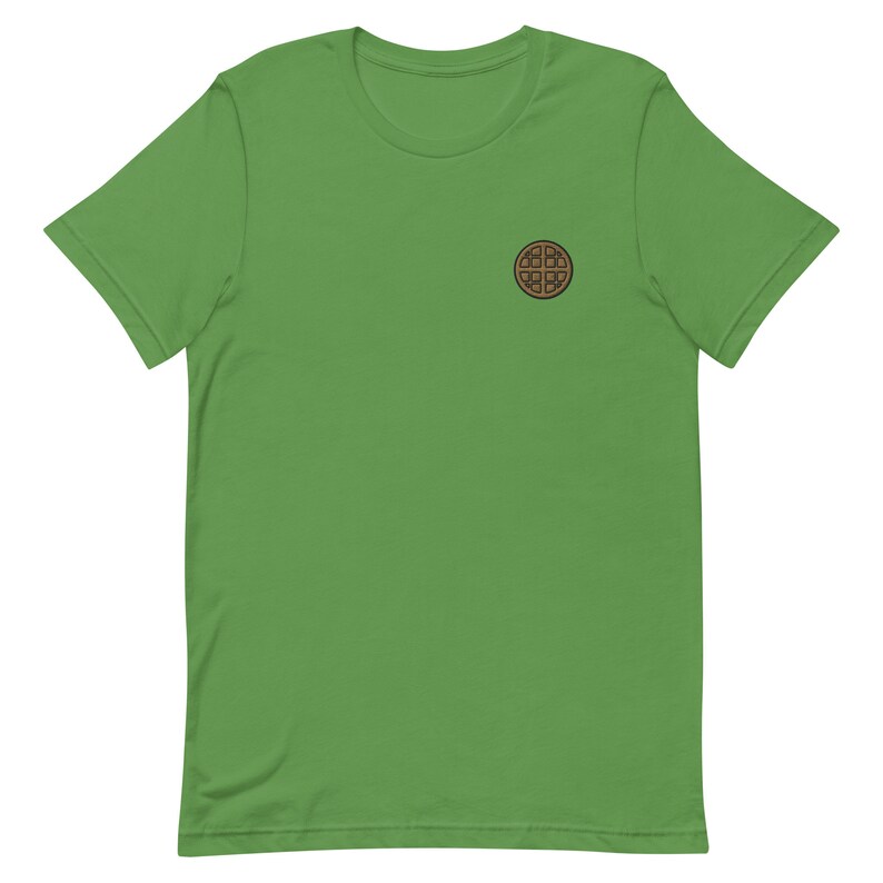 Op de afbeelding: Een groen T-shirt met korte mouwen en een bruine wafelprint op de voorkant.