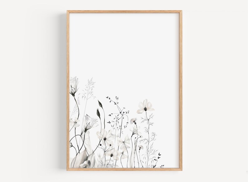 May include: A black and white watercolor illustration of a bouquet of wildflowers in a simple frame. The flowers are delicate and have a soft, romantic feel.
