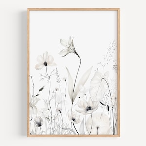 May include: A framed print of a watercolor painting featuring a delicate arrangement of white flowers and leaves on a white background.