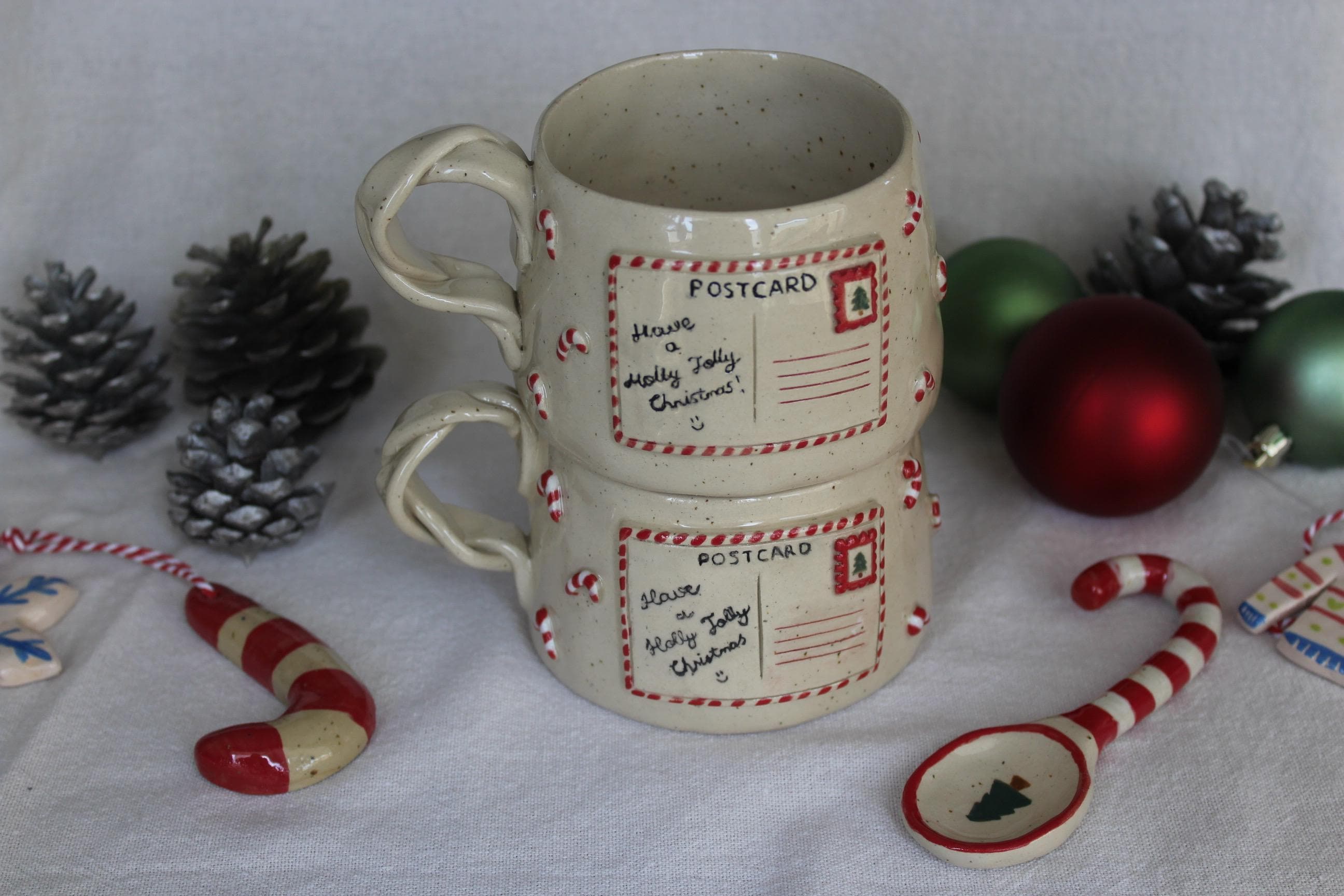 40 Festive Christmas Kitchen Decor Ideas to Spice Up Your Home: Jolly Touches for a Merry Cooking Space 23 Handmade Stoneware Christmas Mug - Holiday Postcard Design