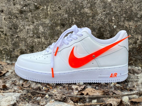 nike shoes with orange swoosh
