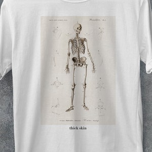 Thick skin skeleton t-shirt, vintage anatomical illustration, sensitive funny ironic quirky quote, trendy, fashion, 100% cotton graphic tee