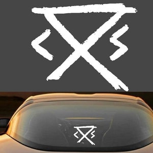 May include: A white symbol with a triangle and two curved lines on either side. The symbol is on a car window.