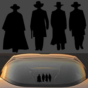 May include: A black silhouette of four figures in cowboy hats and long coats, reminiscent of a Western film. The figures are standing against a gray background. Below, a car's rear window displays a sticker of the same figures.