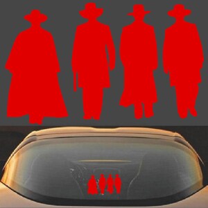 May include: Red silhouette decal featuring four figures in cowboy hats and long coats. The decal is applied to the rear window of a vehicle. The figures are in various poses, suggesting a Western theme.