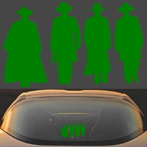 May include: Green silhouette of four figures in cowboy hats and long coats, reminiscent of a Western film. The figures are positioned against a gray background. Below, a car's windshield reflects the figures.