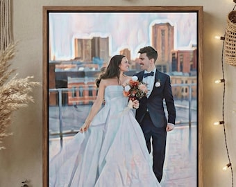 May include: A framed canvas print featuring a couple on their wedding day. The bride wears a white strapless gown, and the groom is in a black tuxedo. The background shows a cityscape with a soft, painterly effect.