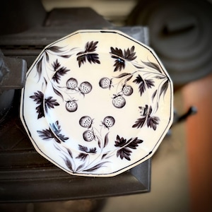 May include: A set of three ceramic mugs with a speckled, matte finish. The mugs are in shades of cream, light gray, and dark gray. Each mug has a simple, minimalist design, perfect for coffee or tea.