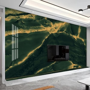 May include: A green and gold marble-effect wall mural with a subtle shimmer. The mural features a swirling pattern of dark green and gold, creating a luxurious and modern look.