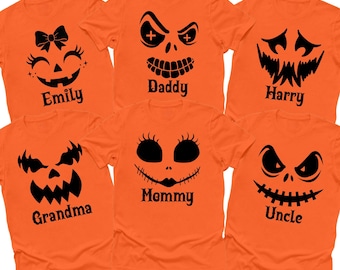 May include: Six bright orange short-sleeve t-shirts featuring black graphic prints of various jack-o'-lantern faces. Each shirt includes a unique facial expression and the printed names Emily, Daddy, Harry, Grandma, Mommy, and Uncle.