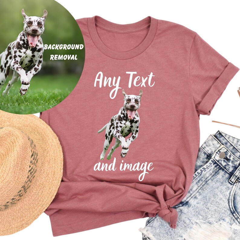 a pink t-shirt with a Dalmatian dog graphic and the text "Any Text and image" printed on it. The t-shirt is placed on a white background, and there is a straw hat and denim jeans visible in the image.