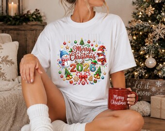 Merry Christmas 2026 Shirt with Cute Snowman and Santa Hat, Festive Xmas Sweatshirt, Holiday Family Gift, Xmas Family Shirt, Merry Christmas